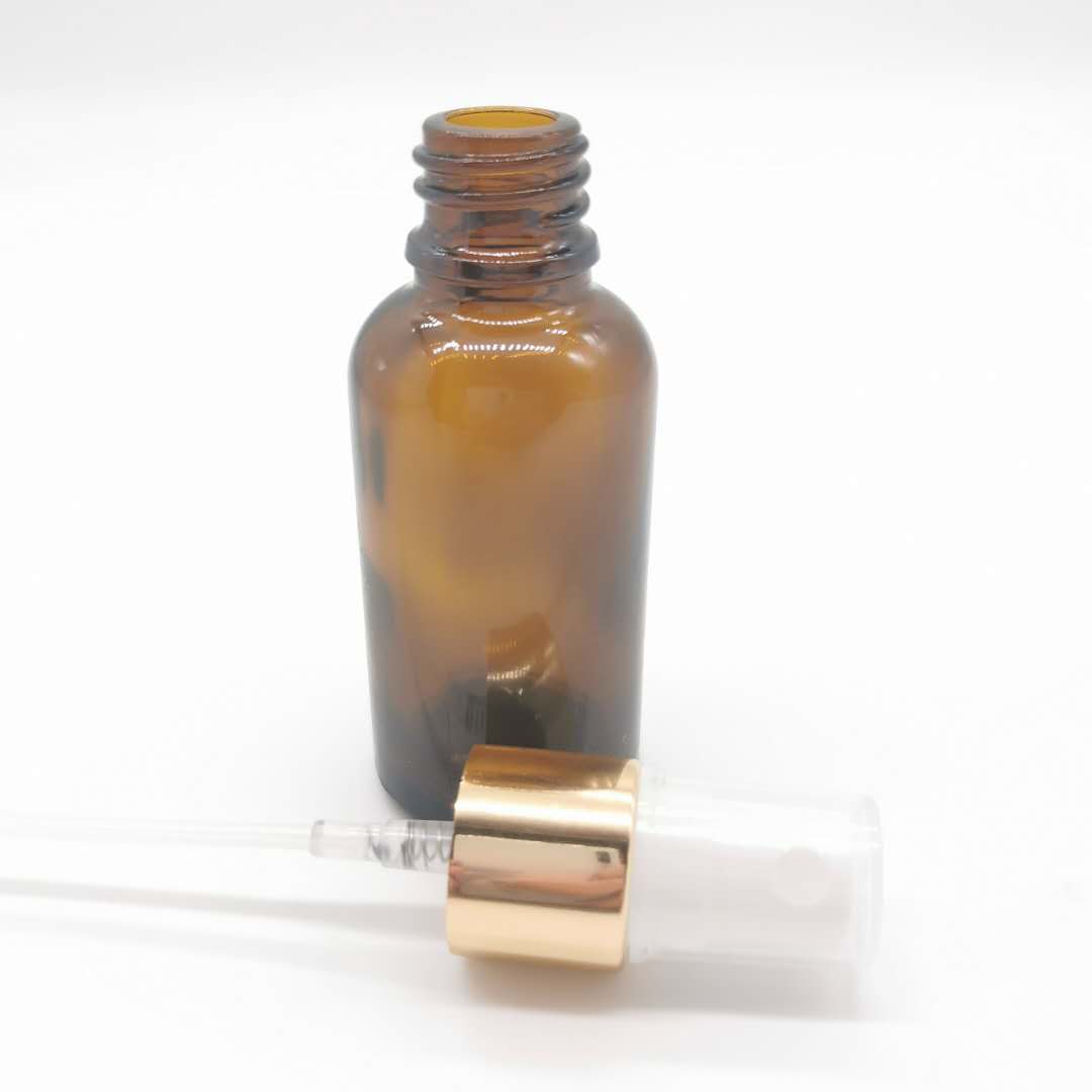 wholesale 30ml amber glass essential oil bottle with aluminum pump sprayer