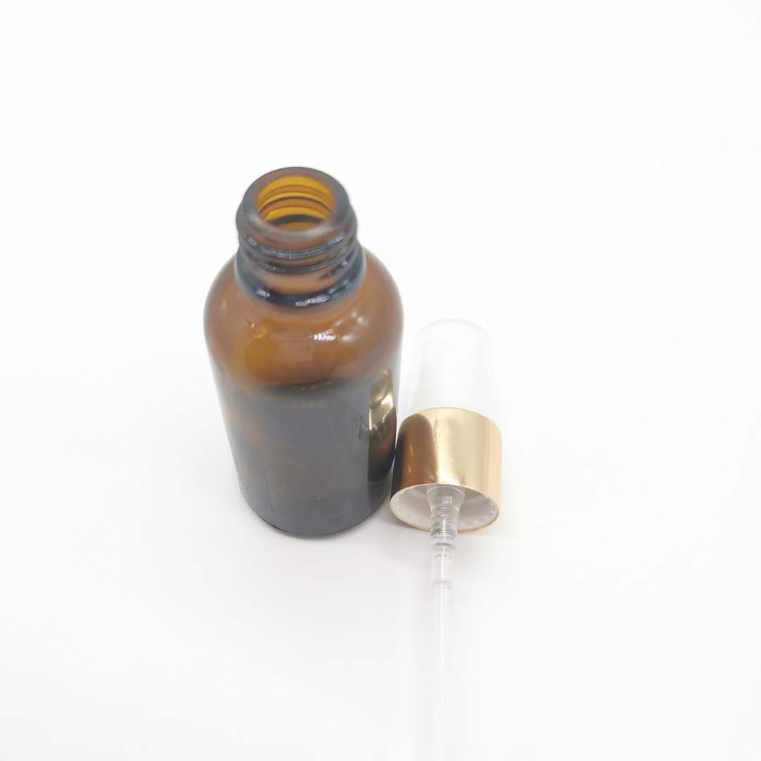 wholesale 30ml amber glass essential oil bottle with aluminum pump sprayer
