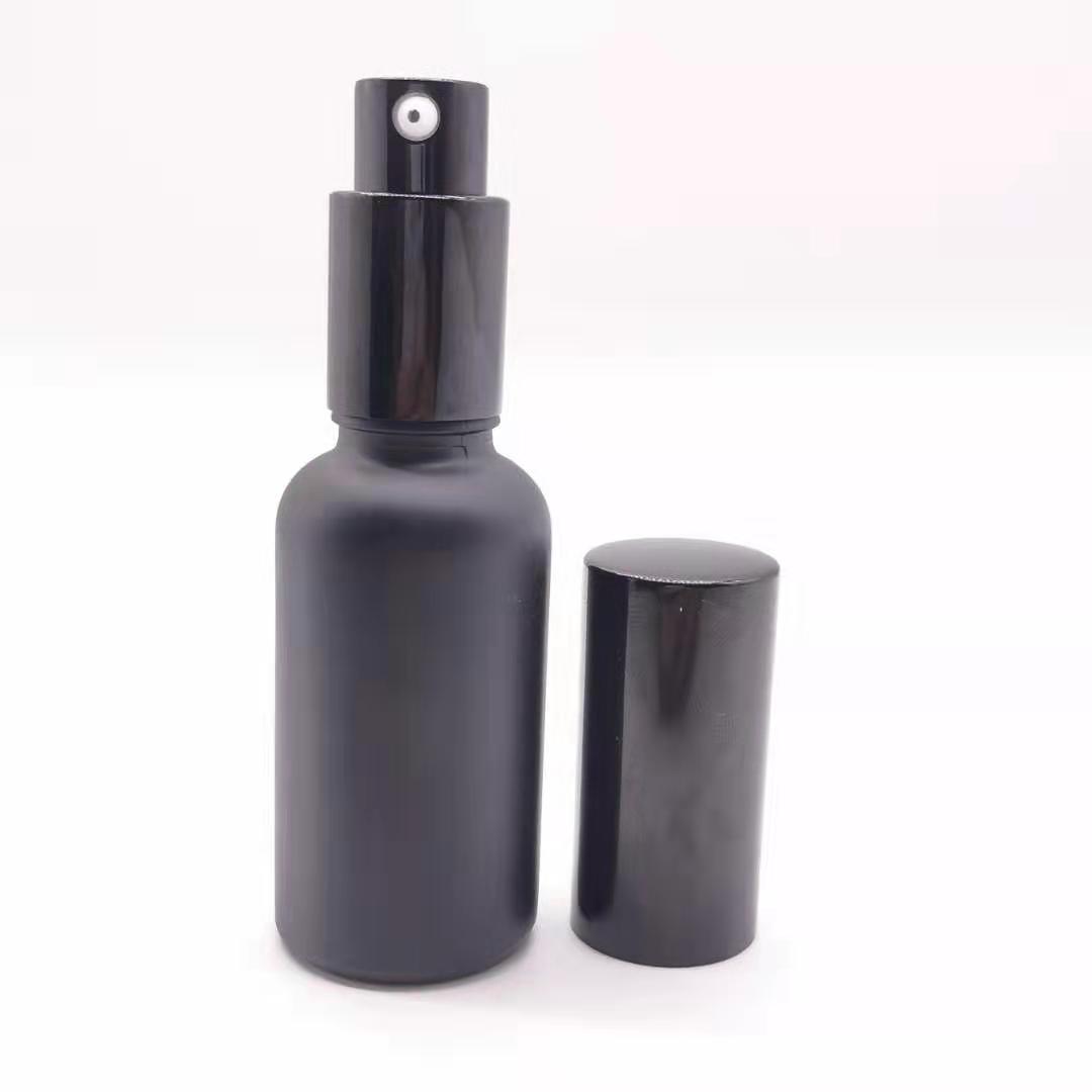 wholesale 30ml black glass essential oil bottle with pump sprayer