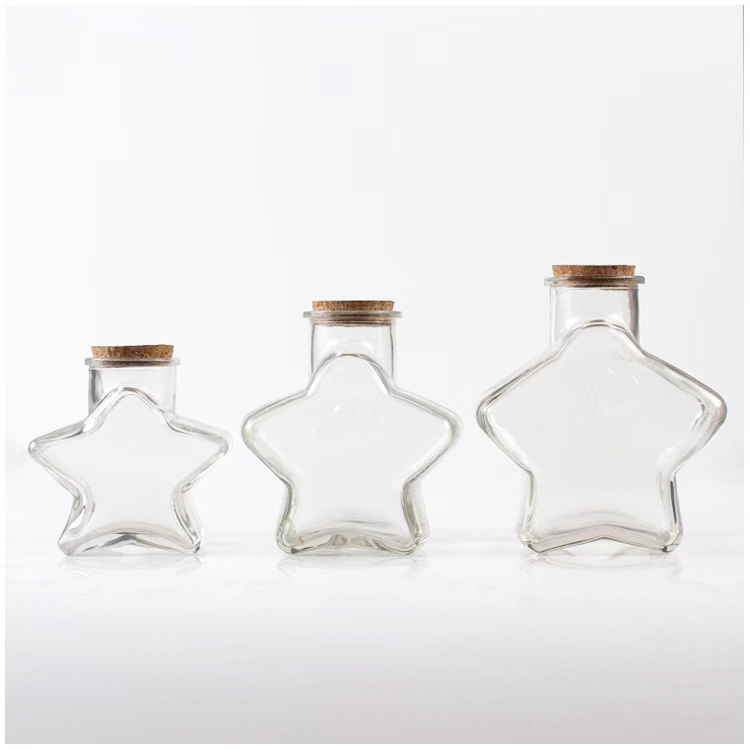 wholesale 50ml 150ml 300ml unique glass candy jars with lids lucky star wishing glass bottles with cork for wedding gift