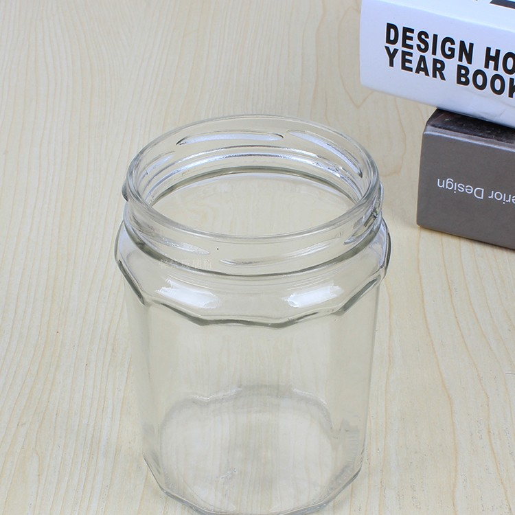 wholesale 50ml-380ml clear polygonal glass canning jar for jam with colored lid