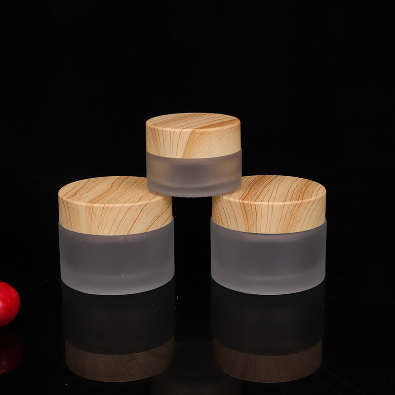 wholesale 5g 10g 15g 20g 30g 50g 60g clear frosted glass cosmetic packaging skincare cream jars with bamboo lids round jars