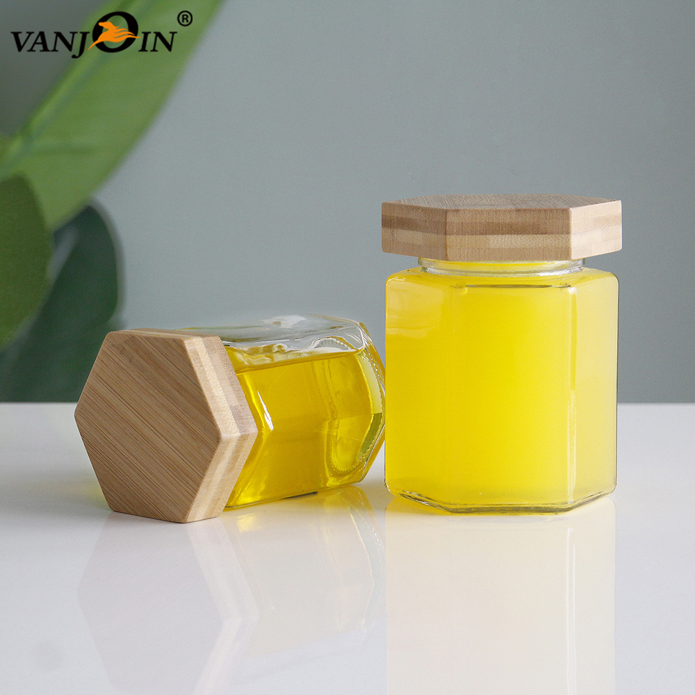 wholesale Empty Hexagonal Glass Jars with Wooden Lids honey bee jam filling containers 250ml 350ml for sale