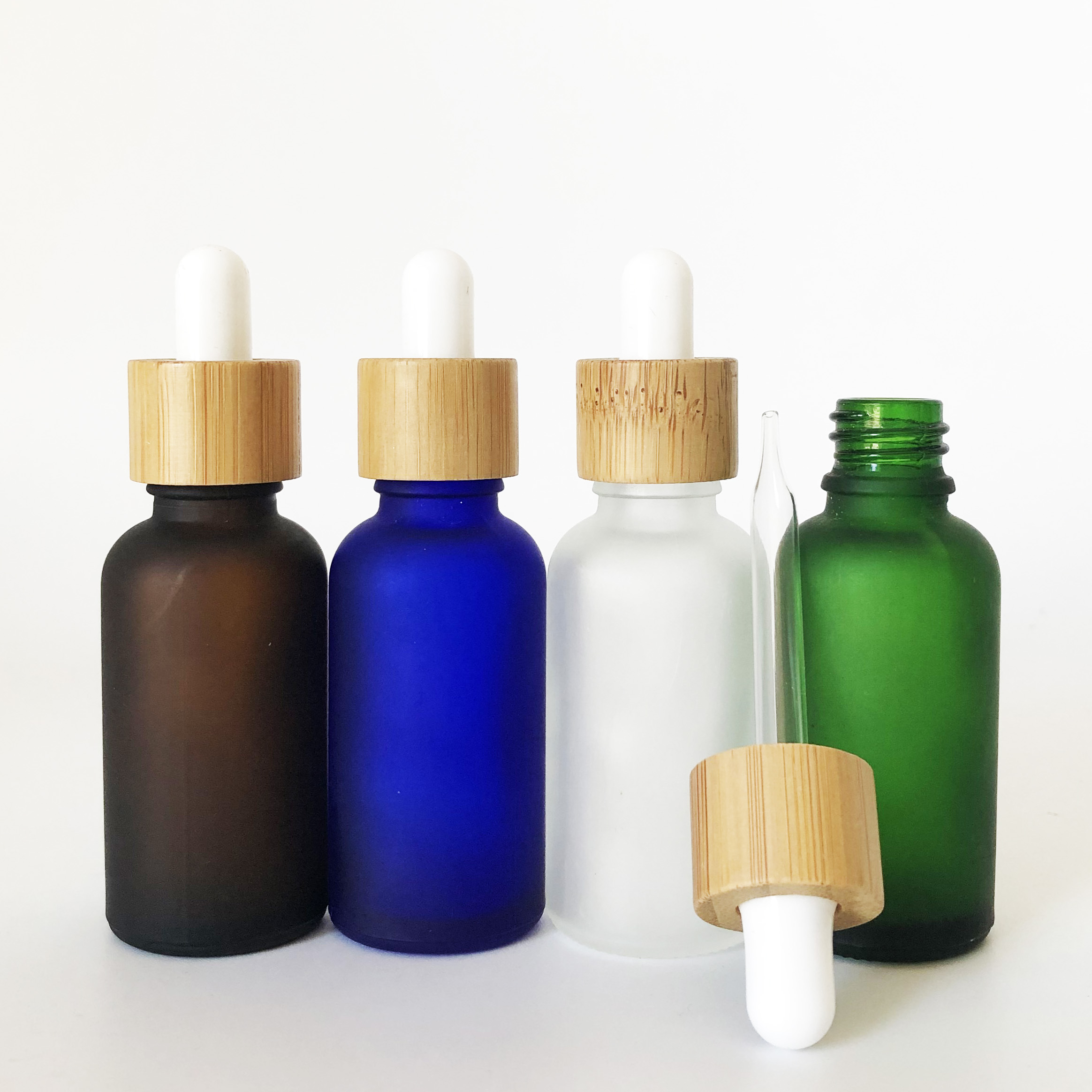 wholesale bamboo cap 30ml green blue clear amber frosted glass dropper bottle with bamboo wooden lid