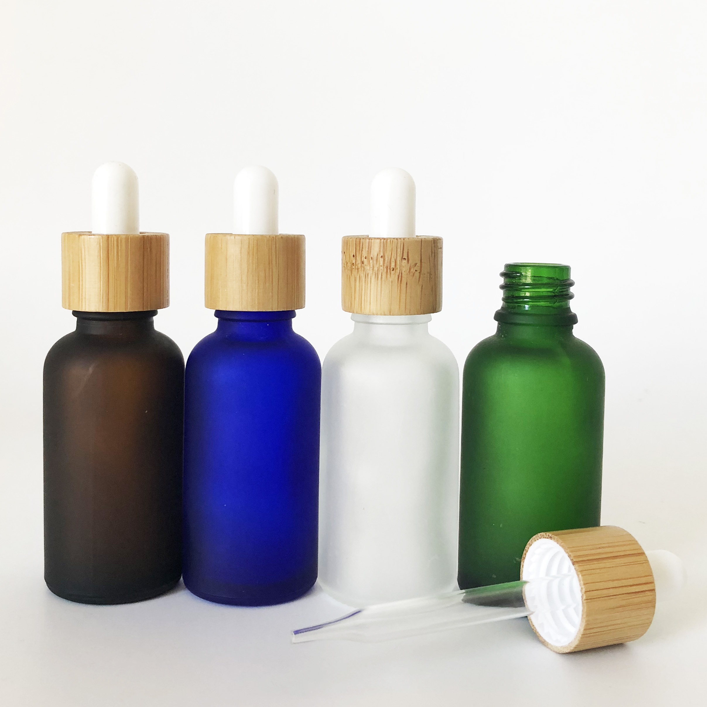 wholesale bamboo cap 30ml green blue clear amber frosted glass dropper bottle with bamboo wooden lid