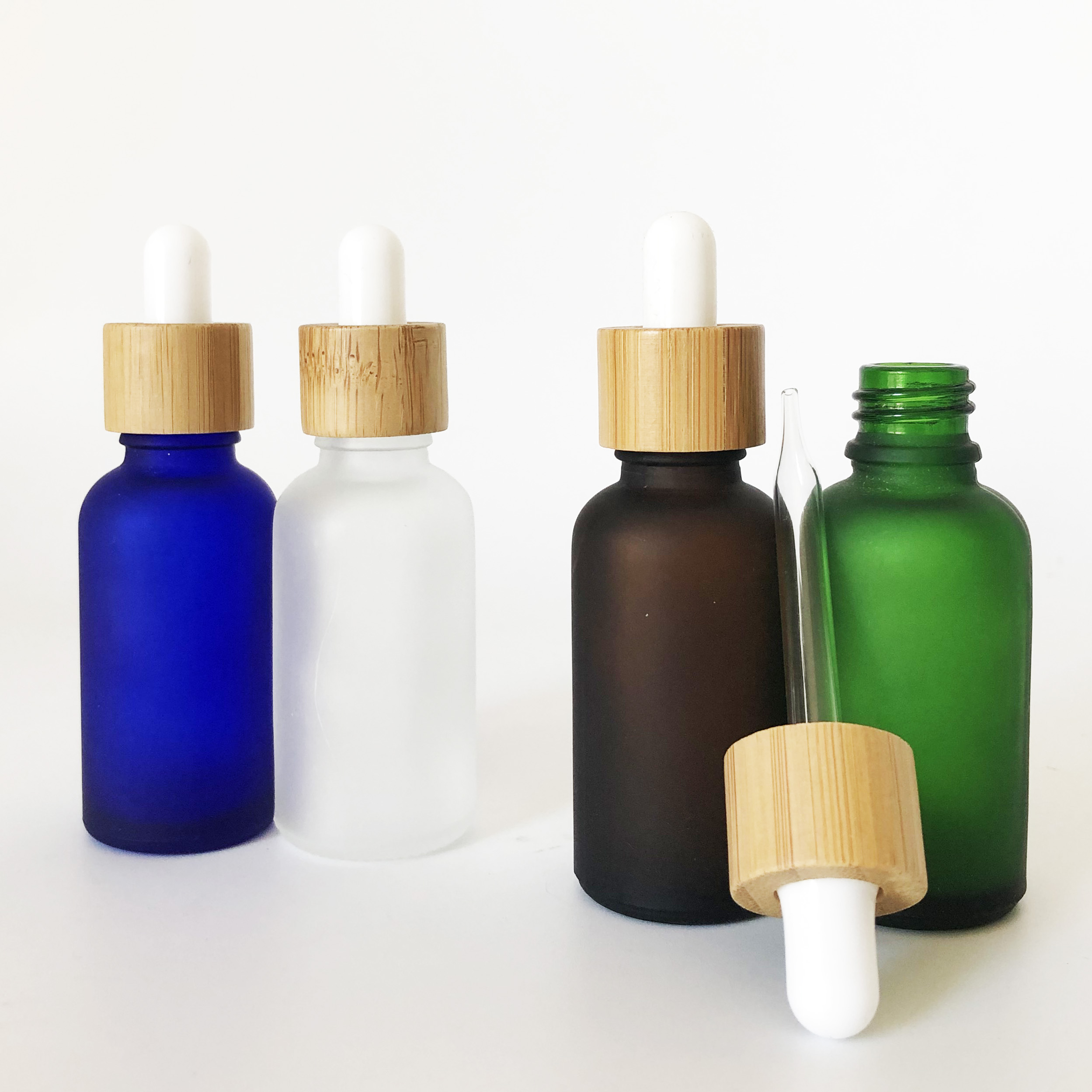wholesale bamboo cap 30ml green blue clear amber frosted glass dropper bottle with bamboo wooden lid