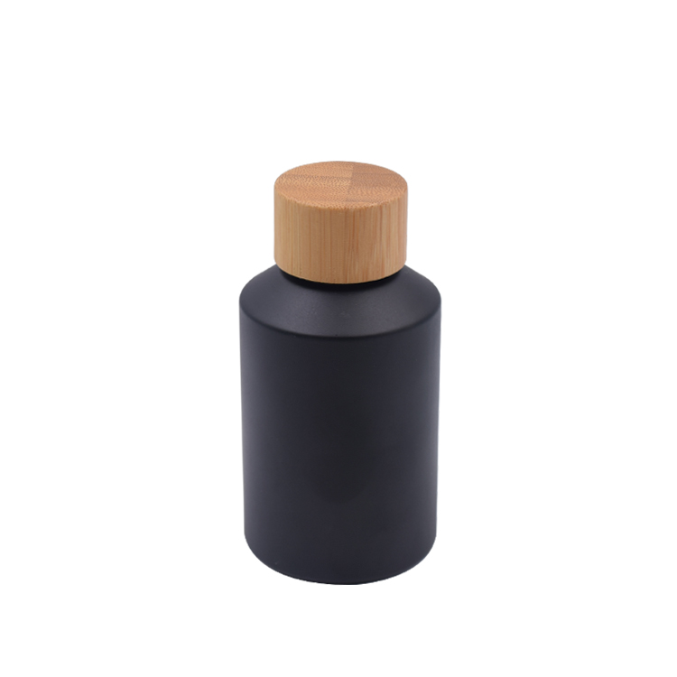 wholesale bamboo container 30ml 60ml 125ml wood and black glass cosmetic packaging with bamboo cap