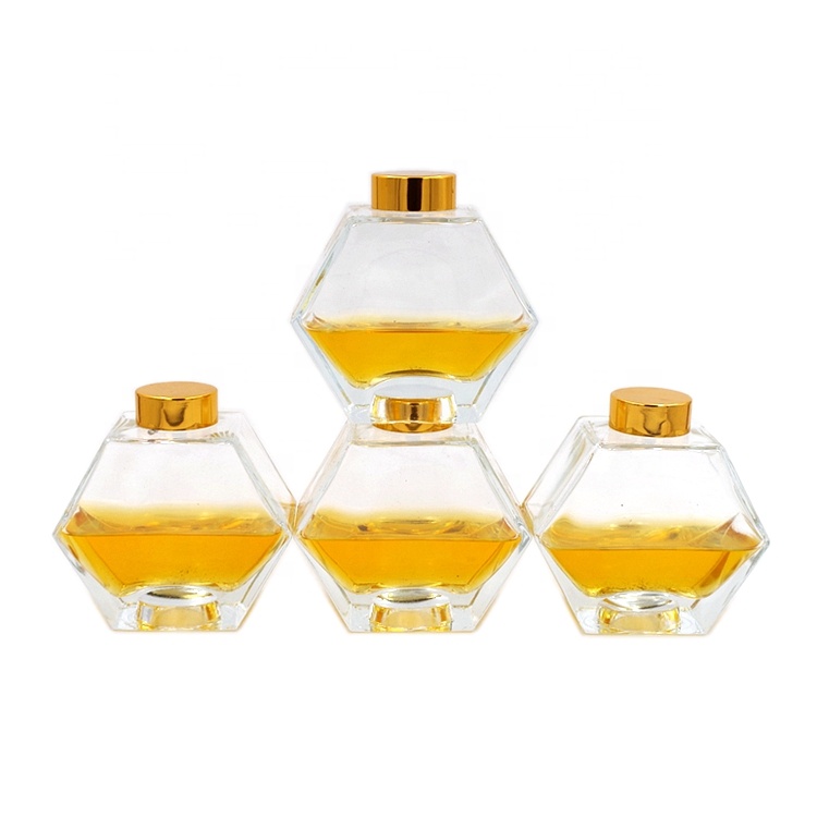 wholesale cheap 250ml honeycomb hexagon polygon glass bottle honey glass jar with gold screw lid