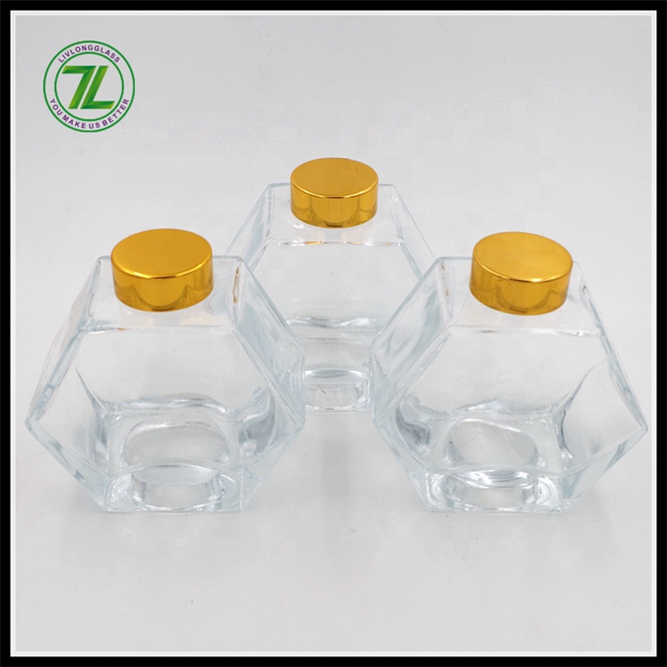 wholesale cheap 250ml honeycomb hexagon polygon glass bottle honey glass jar with gold screw lid