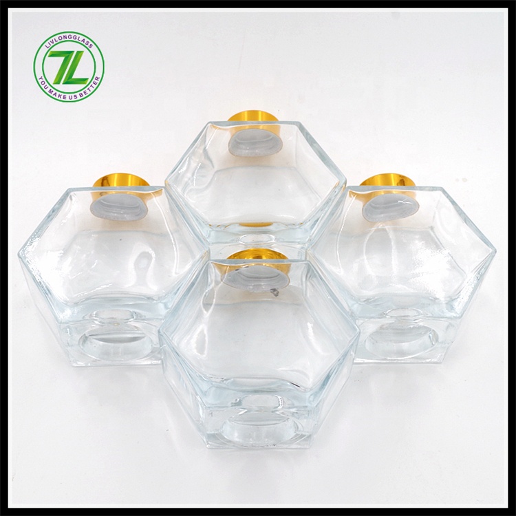 wholesale cheap 250ml honeycomb hexagon polygon glass bottle honey glass jar with gold screw lid