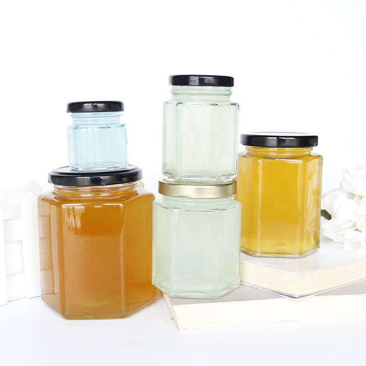 wholesale cheap hexagon food storagehoneyemptyglassjarsfor food canning with lid