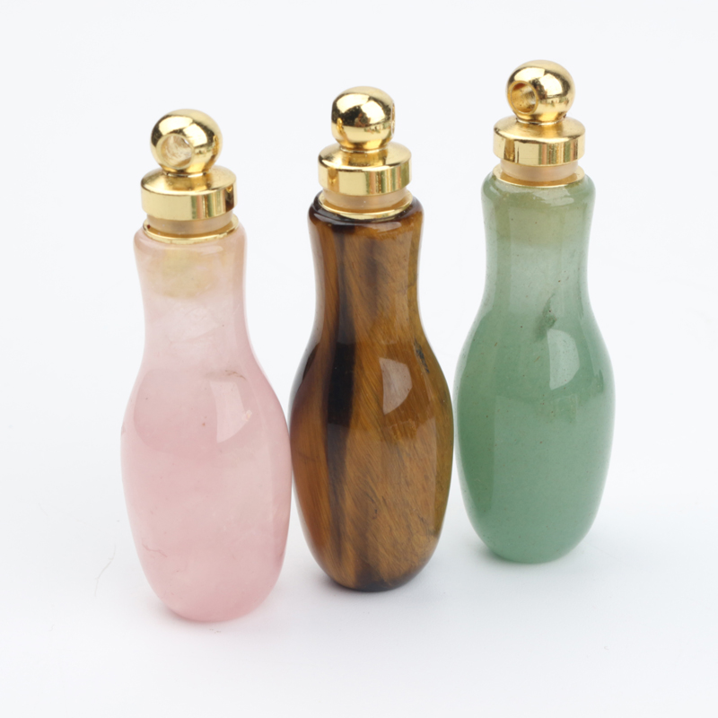 wholesale custom design natural rock crystal stone hand carved empty perfume bottle Oil Bottles