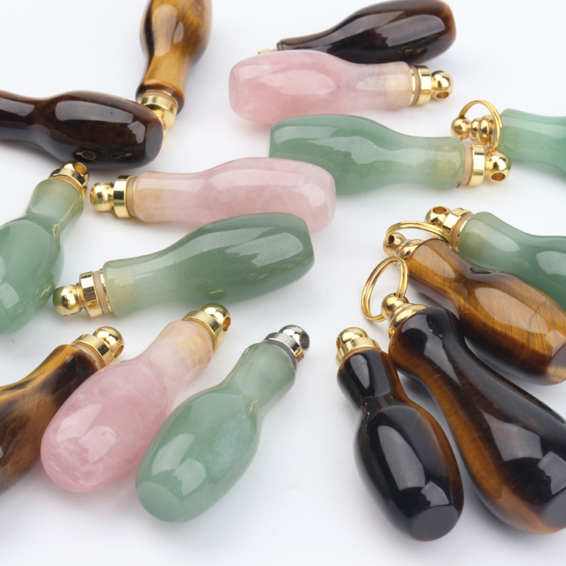 wholesale custom design natural rock crystal stone hand carved empty perfume bottle Oil Bottles