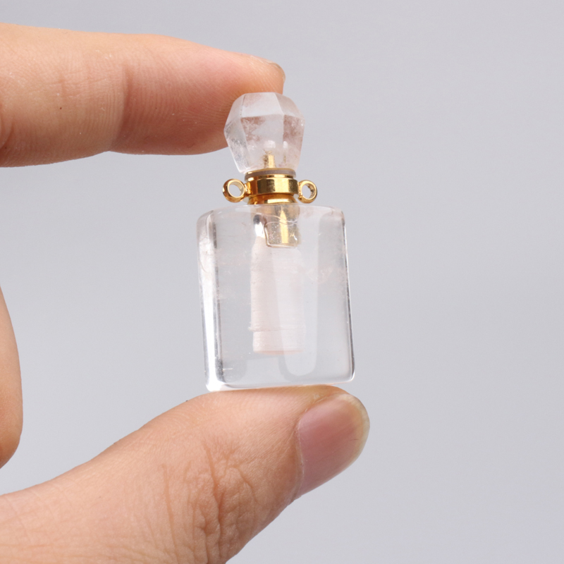 wholesale custom design natural rock crystal stone hand carved empty perfume bottle Oil Bottles