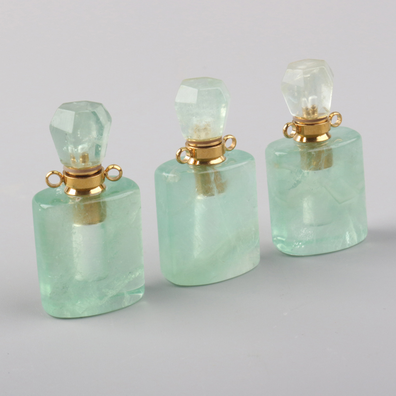 wholesale custom design natural rock crystal stone hand carved empty perfume bottle Oil Bottles