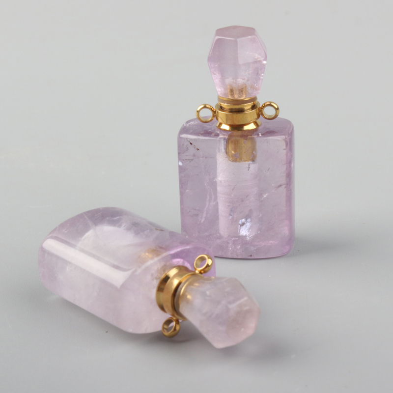 wholesale custom design natural rock crystal stone hand carved empty perfume bottle Oil Bottles