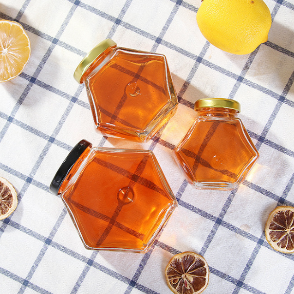 wholesale custom logo printing stock hexagon storage nuts canning spice container glass jars for honey