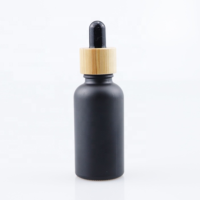 wholesale essential oil bottle glass dropper bottle with bamboo cap 10ml 30ml 60ml 100ml matt black tinture oil bottle