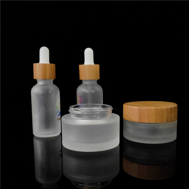 wholesale frosted cosmetic glass jar 50ml 100ml with bamboo lid frasco de vidrio bocal verre