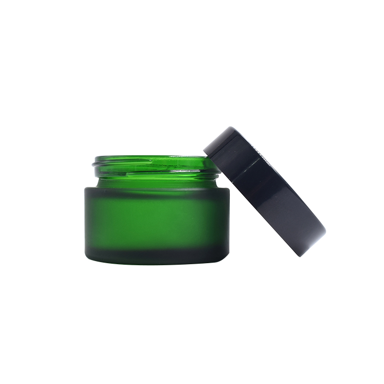 wholesale frosted green glass container black lid cosmetic cream lotion glass jar