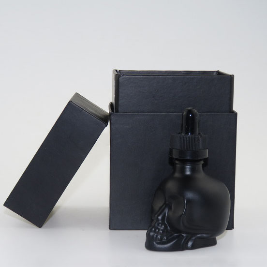 wholesale glass bottles hot sale black dropper bottle glass skull 30ml glass dropper bottles black matte with packing tube