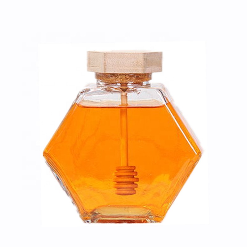wholesale  glass hexagon honey storage jar glass honey jar with wooden stirrer
