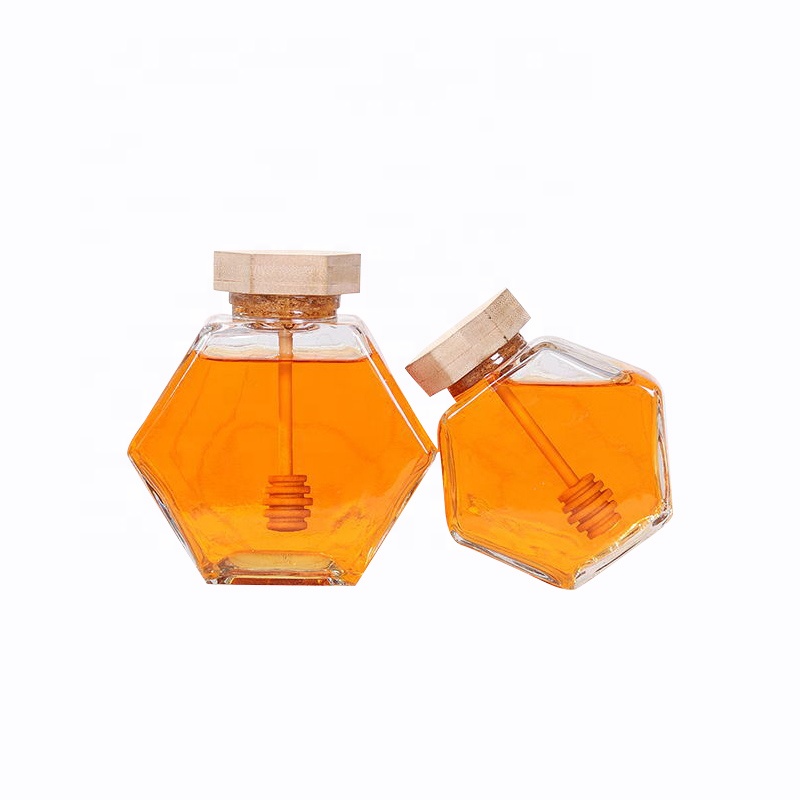 wholesale glass hexagon honey storage jar glass honey jar with wooden stirrer