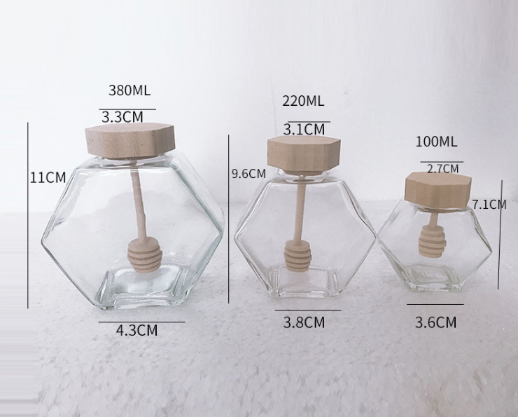 wholesale glass hexagon honey storage jar glass honey jar with wooden stirrer