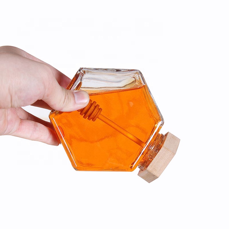 wholesale glass hexagon honey storage jar glass honey jar with wooden stirrer
