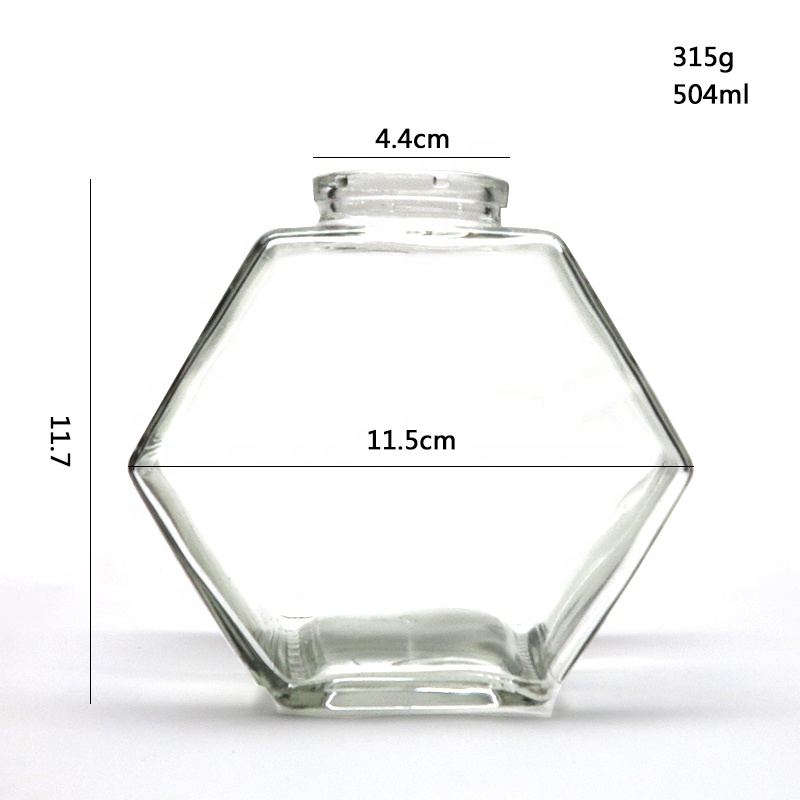 wholesale glass hexagon honey storage jar glass honey jar with wooden stirrer