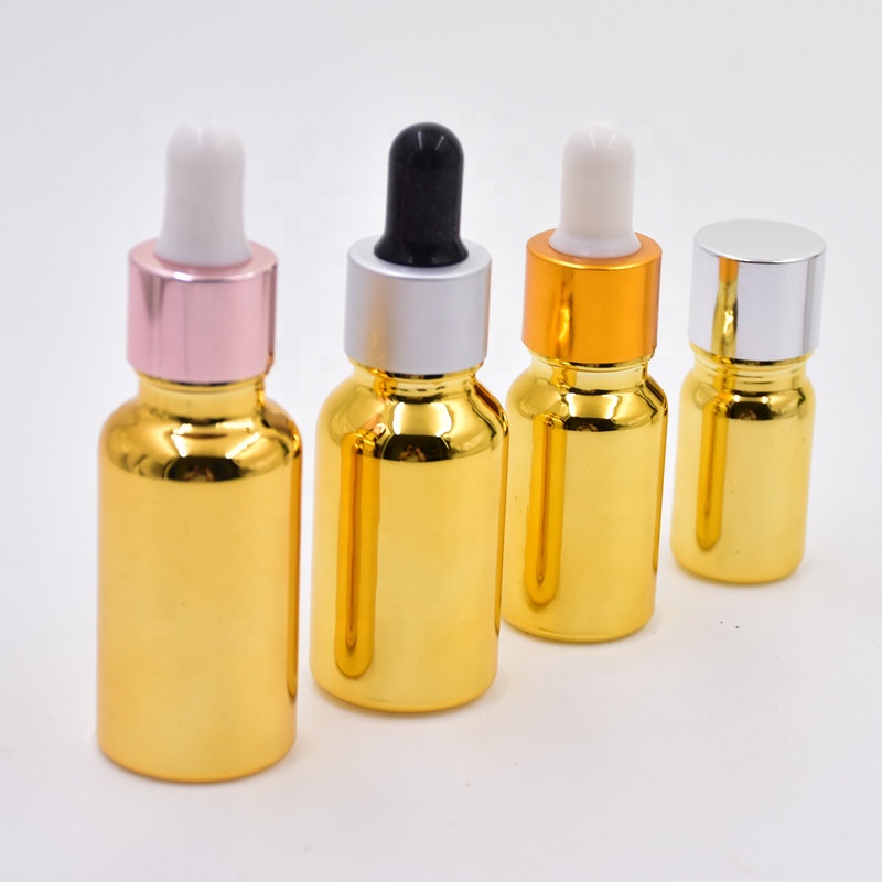 wholesale luxury 30ml gold electroplated cosmetic glass essential oil bottles cosmetic package with dropper pump sprayer lid