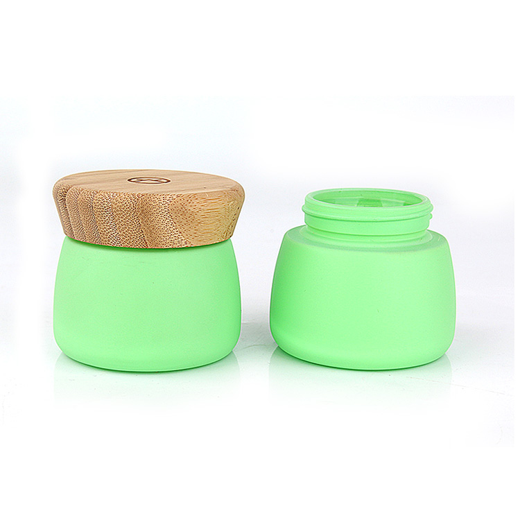 wholesale matte green face pack glass container and jar with bamboo wooden lid