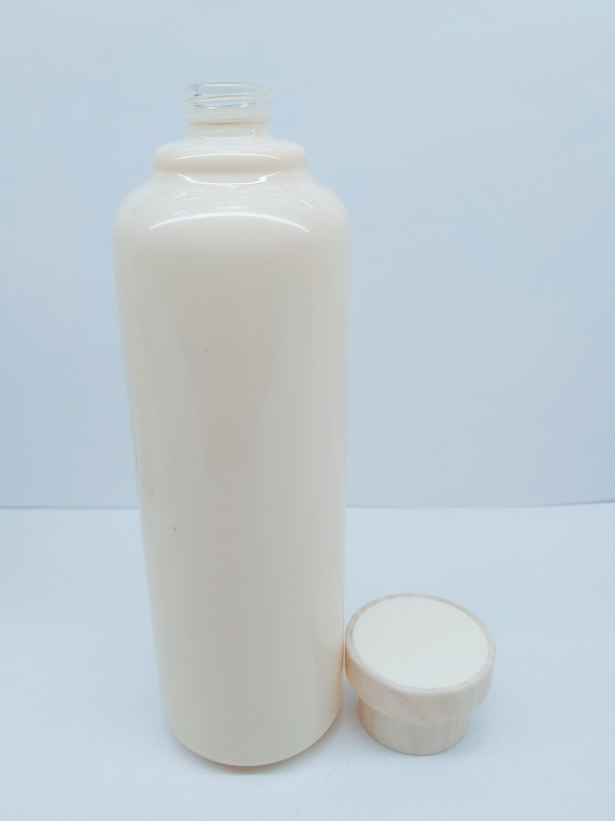 wholesale round shaped bamboo cap emulsion cream glass bottle