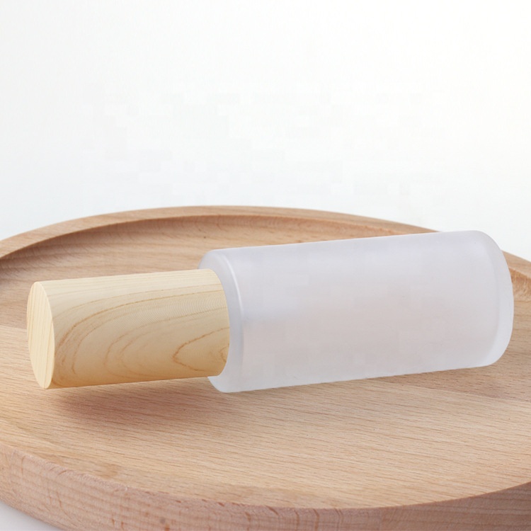 wood grain cosmetic packaging 30ml 50ml 60ml 80ml 100ml 120ml frosted glass serum pump bottles with water transfer wooden lid