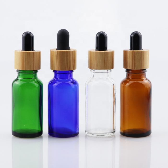wooden bamboo cap essential oil glass bottle amber blue clear and green glass dropper 10ml 30 ml 60ml cosmetic body care bottle